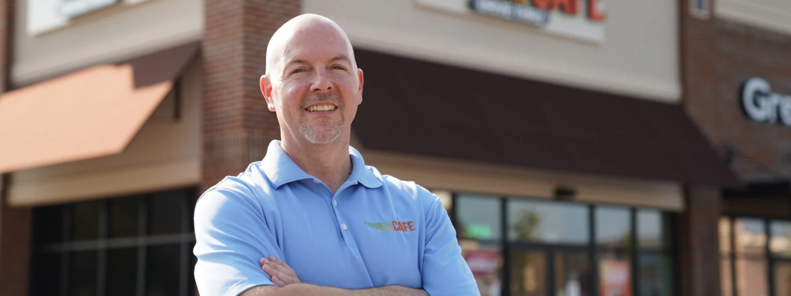 Franchise Owner Mike Haines in front of his Tropical Smoothie Cafe