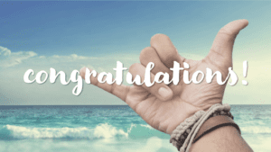 Hang loose hands with Congratulations with a beach background