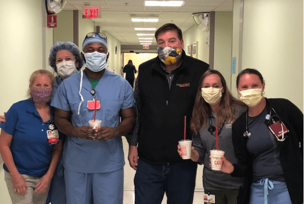 Tropical Smoothie Cafe workers delivering smoothies to hospital
