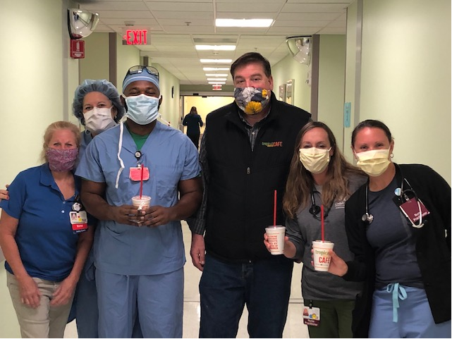 Tropical Smoothie Cafe workers delivering smoothies to hospital