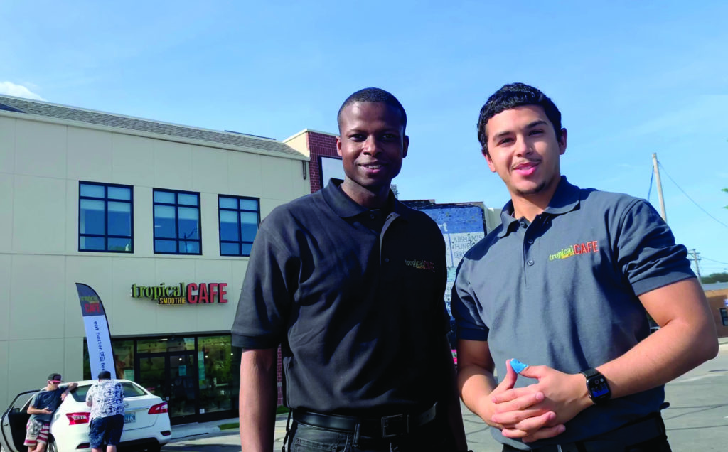 marlon and cesar, tropical smoothie cafe franchise owners standing outside their location