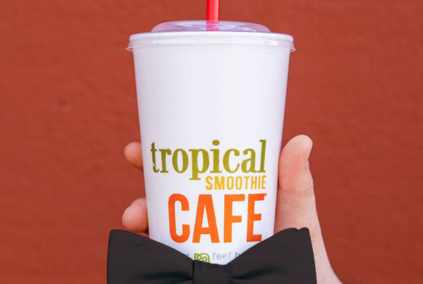 tropical smoothie cafe cup with a black bow tie