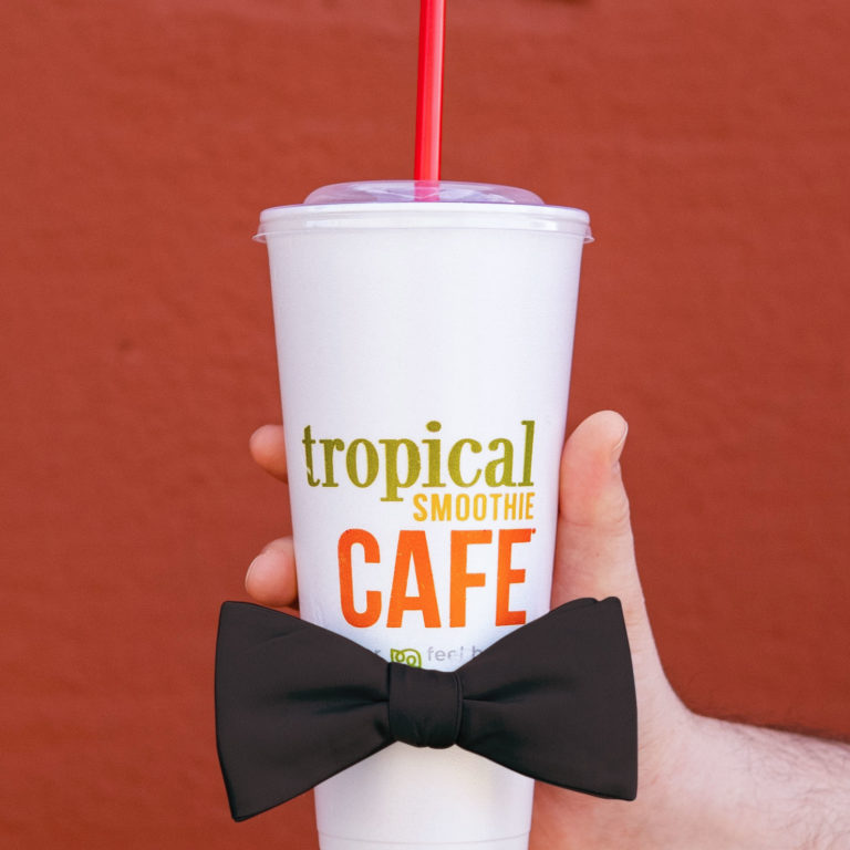 tropical smoothie cafe cup with a black bow tie