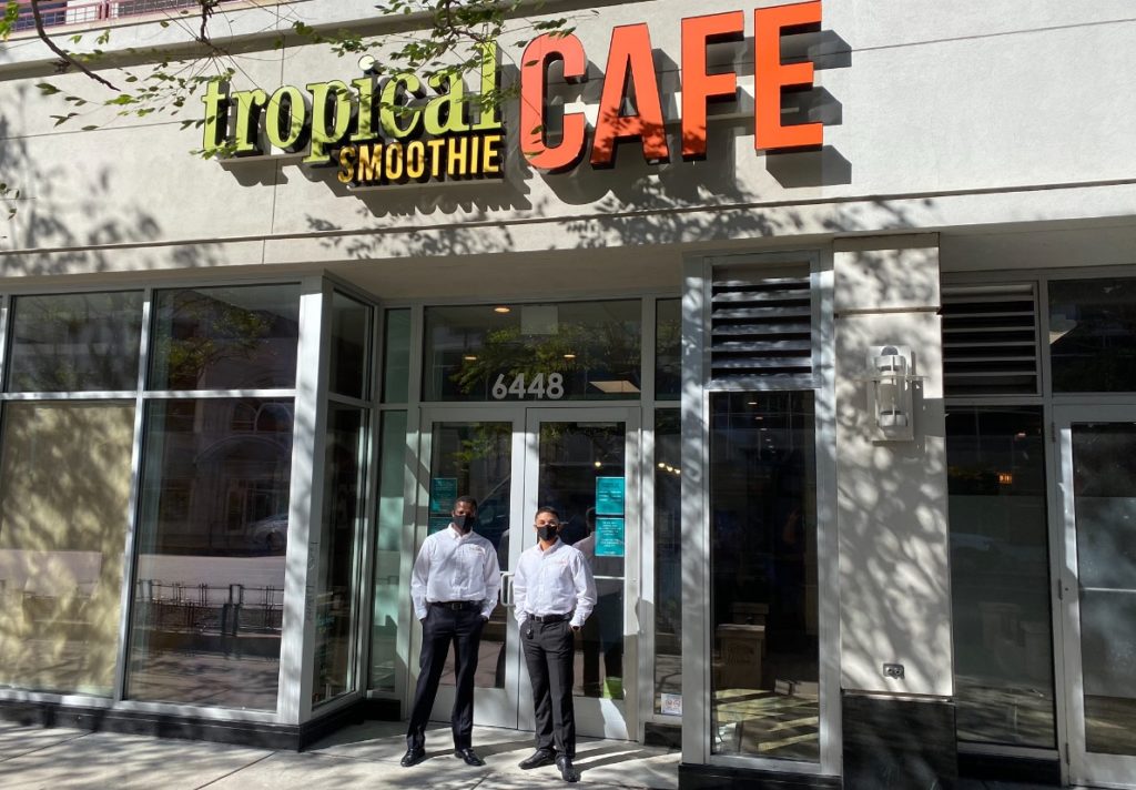 Marlon Sullivan and Cesar Coronado Jr. in front of their Tropical Smoothie Cafe