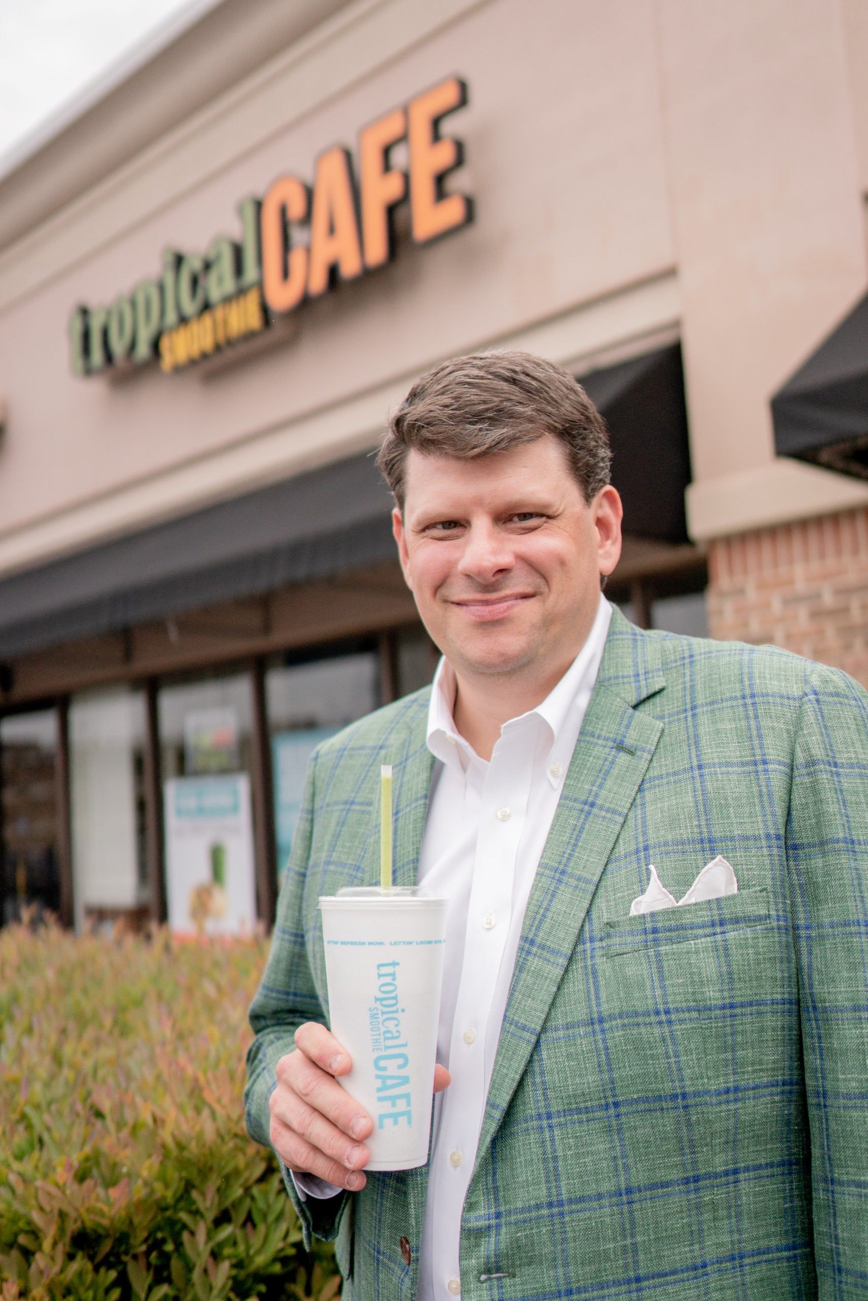 Charles Watson holding a smoothie outside a Tropical Smoothie Cafe