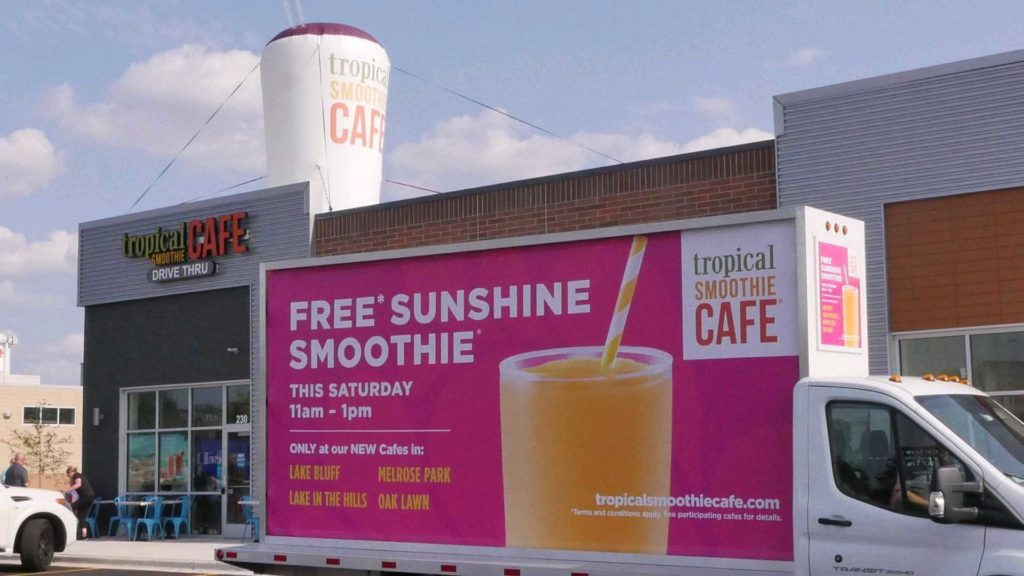 Free Sunshine Smoothie sign at Grand Opening that